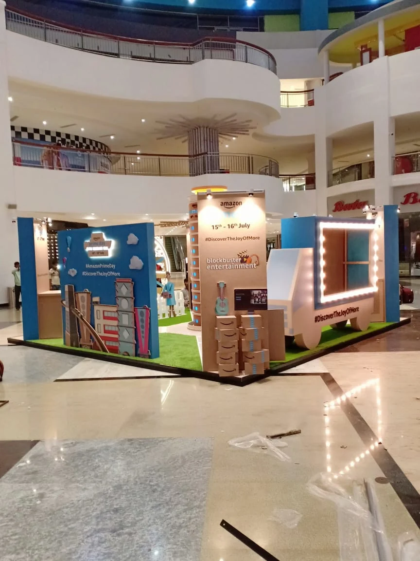 Full Prime Day experience zone — delivery truck, tower and cardboard city in the mall