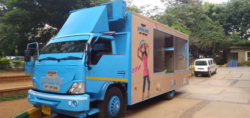 Prime Day blue experience truck with walk-in showroom parked on the city circuit