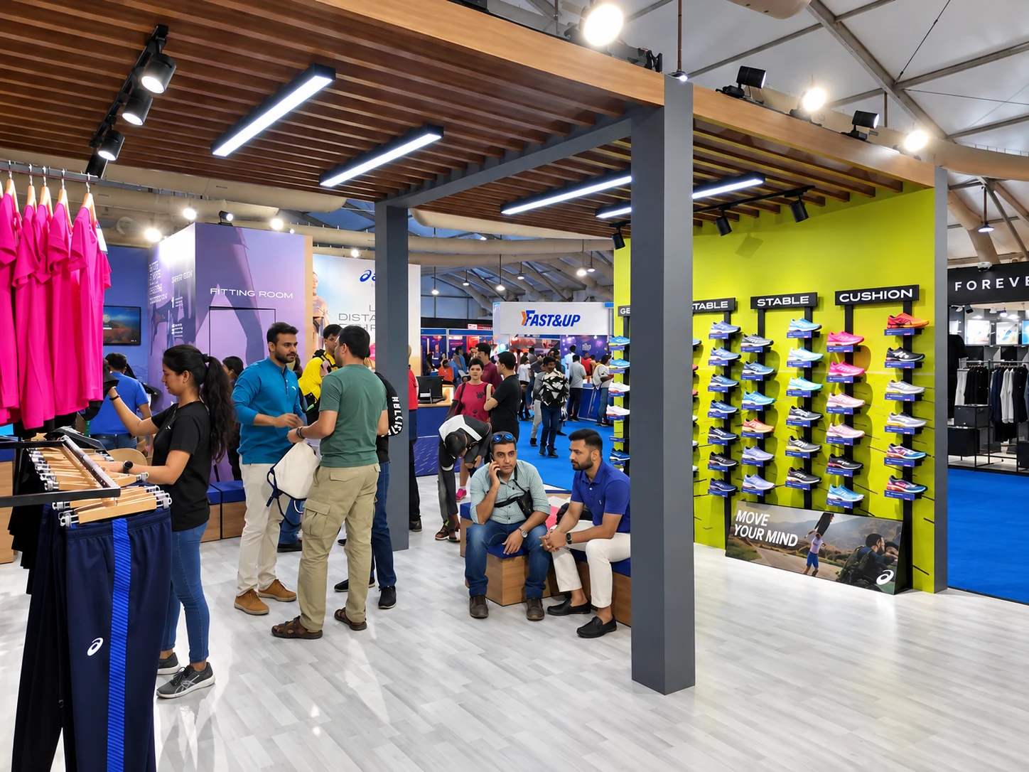 Visitors browsing the STABLE and CUSHION shoe walls at the ASICS TMM Expo