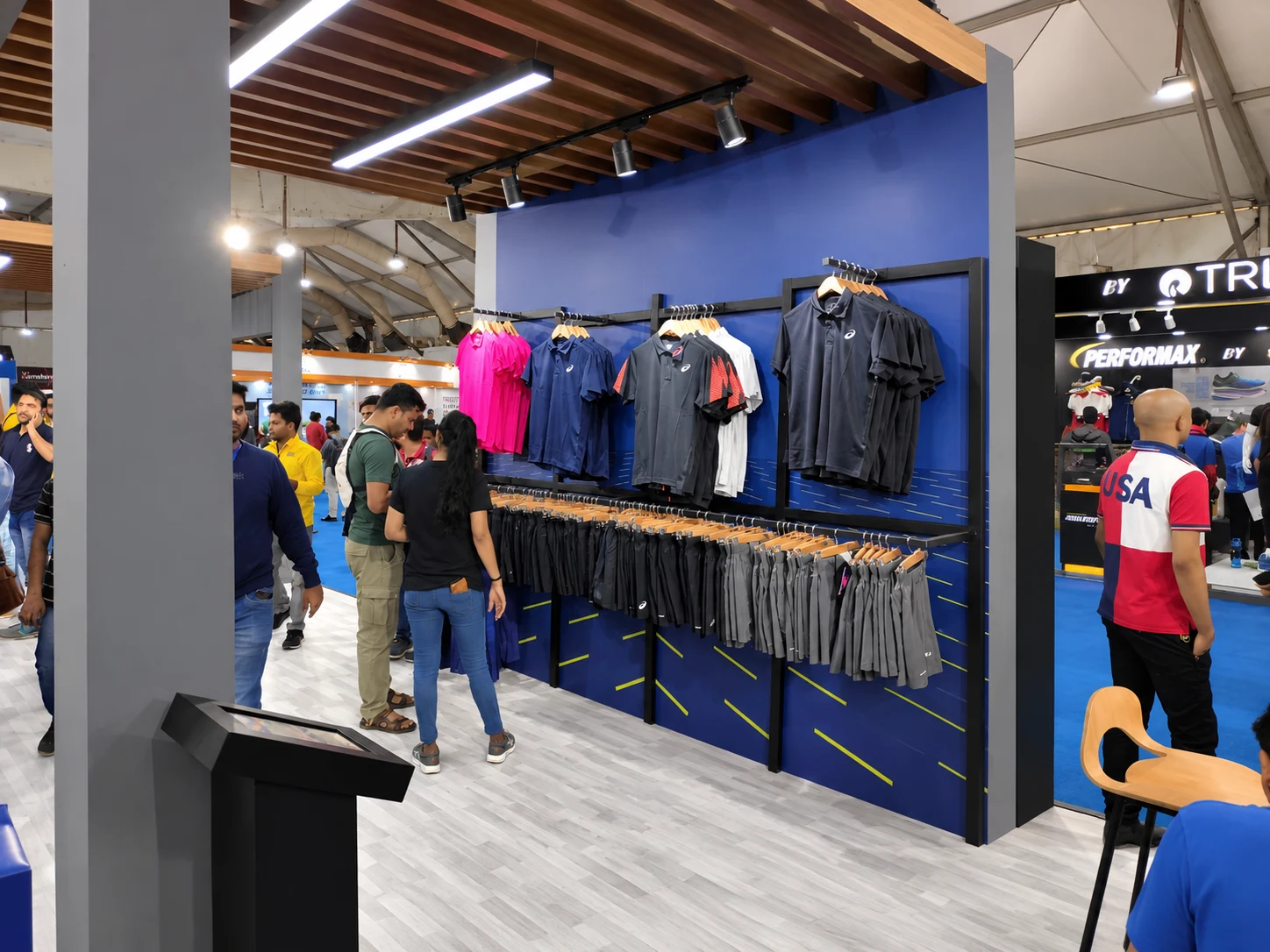 ASICS apparel racks with running tees and shorts at the expo
