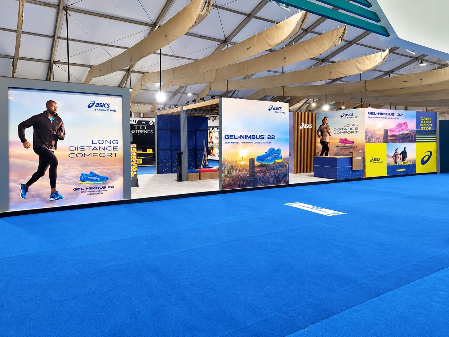 Full ASICS booth panorama with Long Distance Comfort and GEL-NIMBUS 22 branding