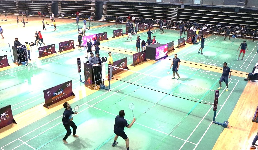 Multiple badminton courts in action at the Clash of the Baddies arena