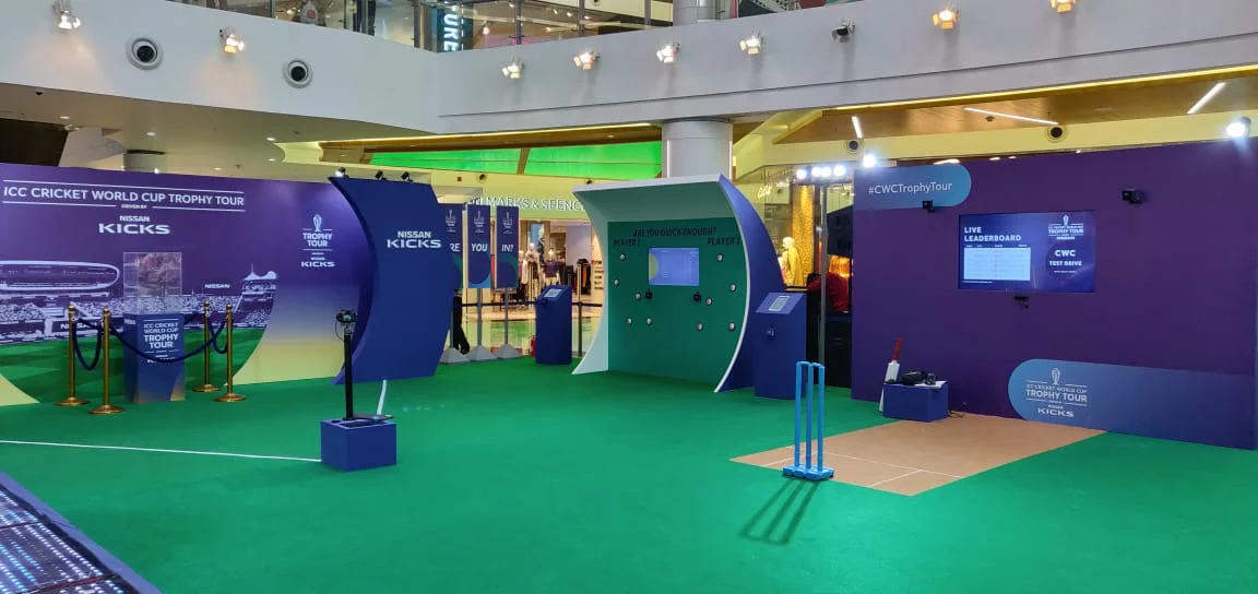 Trophy Tour experience zone with cricket stumps game and live leaderboard screen
