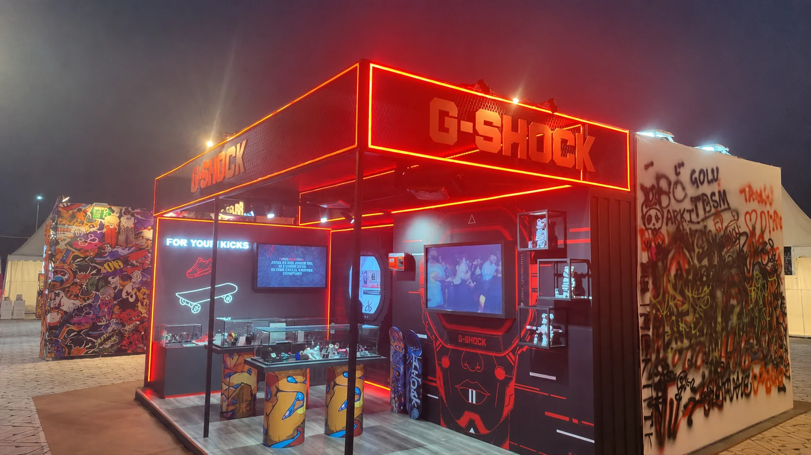 G-SHOCK pop-up pavilion glowing in red neon at night