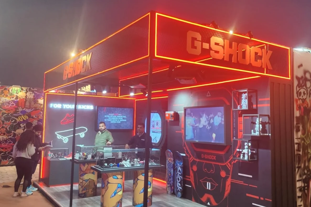 G-SHOCK pavilion glowing in red neon at night