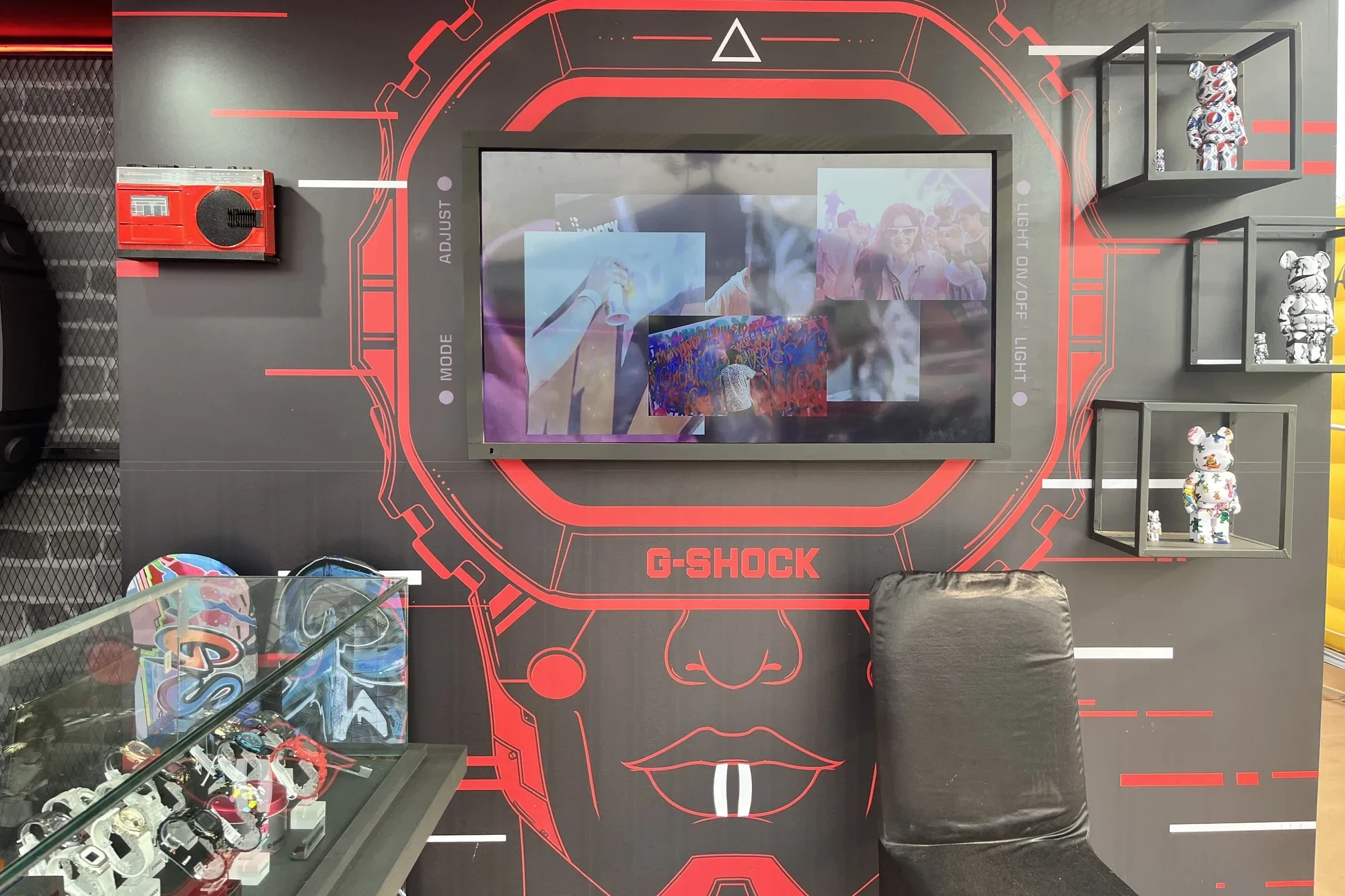 Watch-face feature wall with screen and graffiti detailing