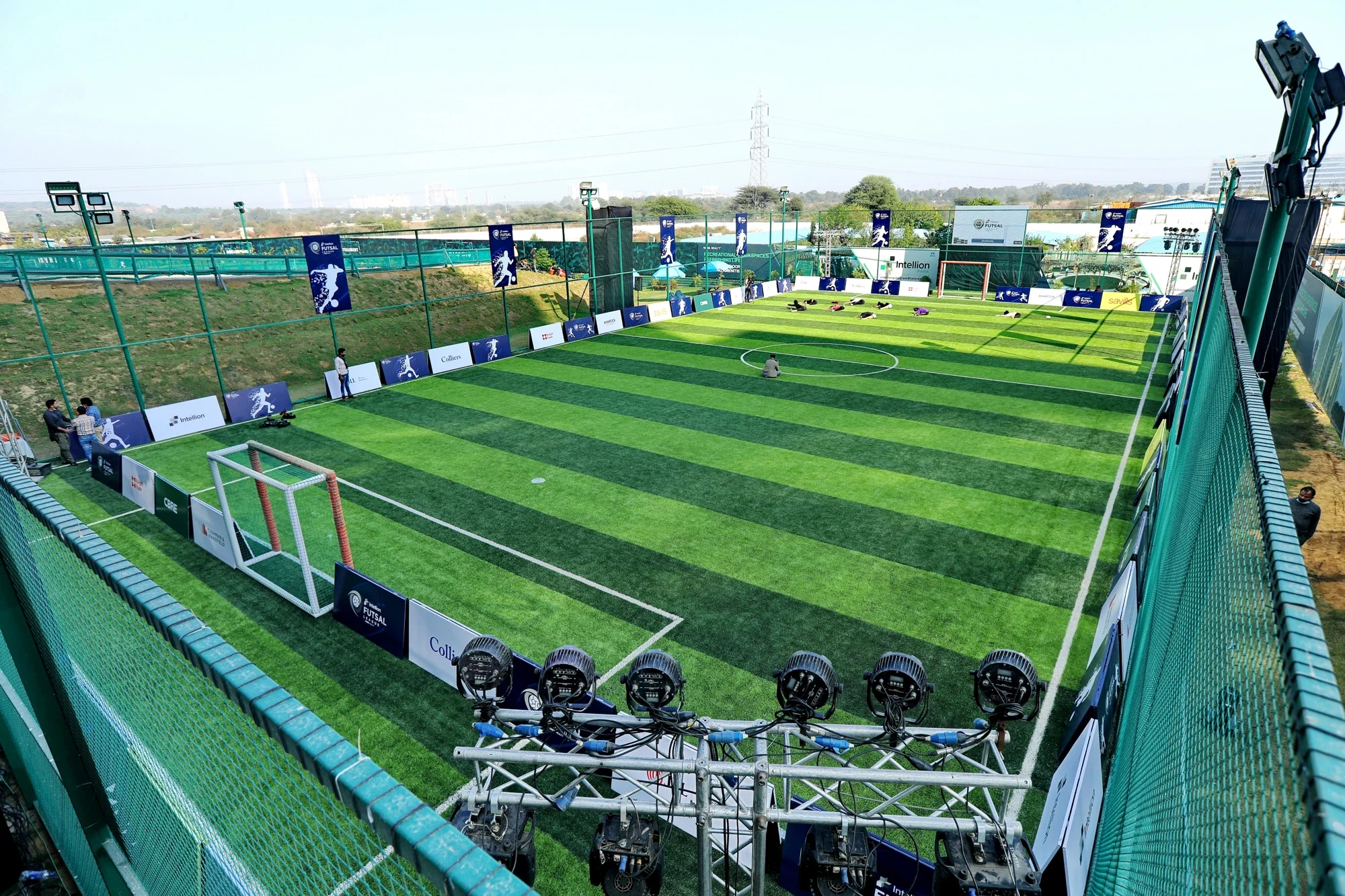 Aerial view of the branded Intellion Futsal League arena with floodlights