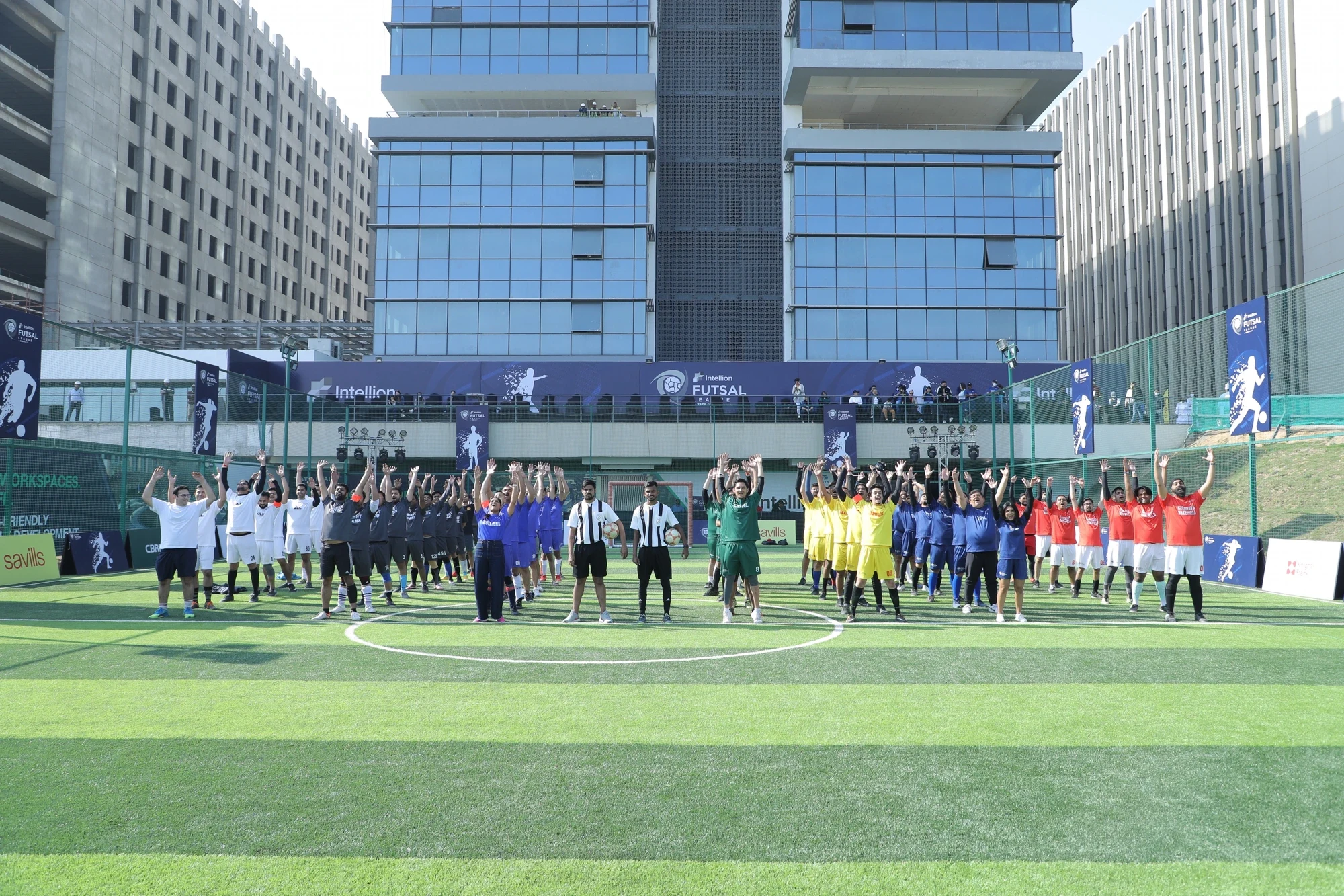 All eight corporate teams lined up on court at the Intellion Futsal League opener