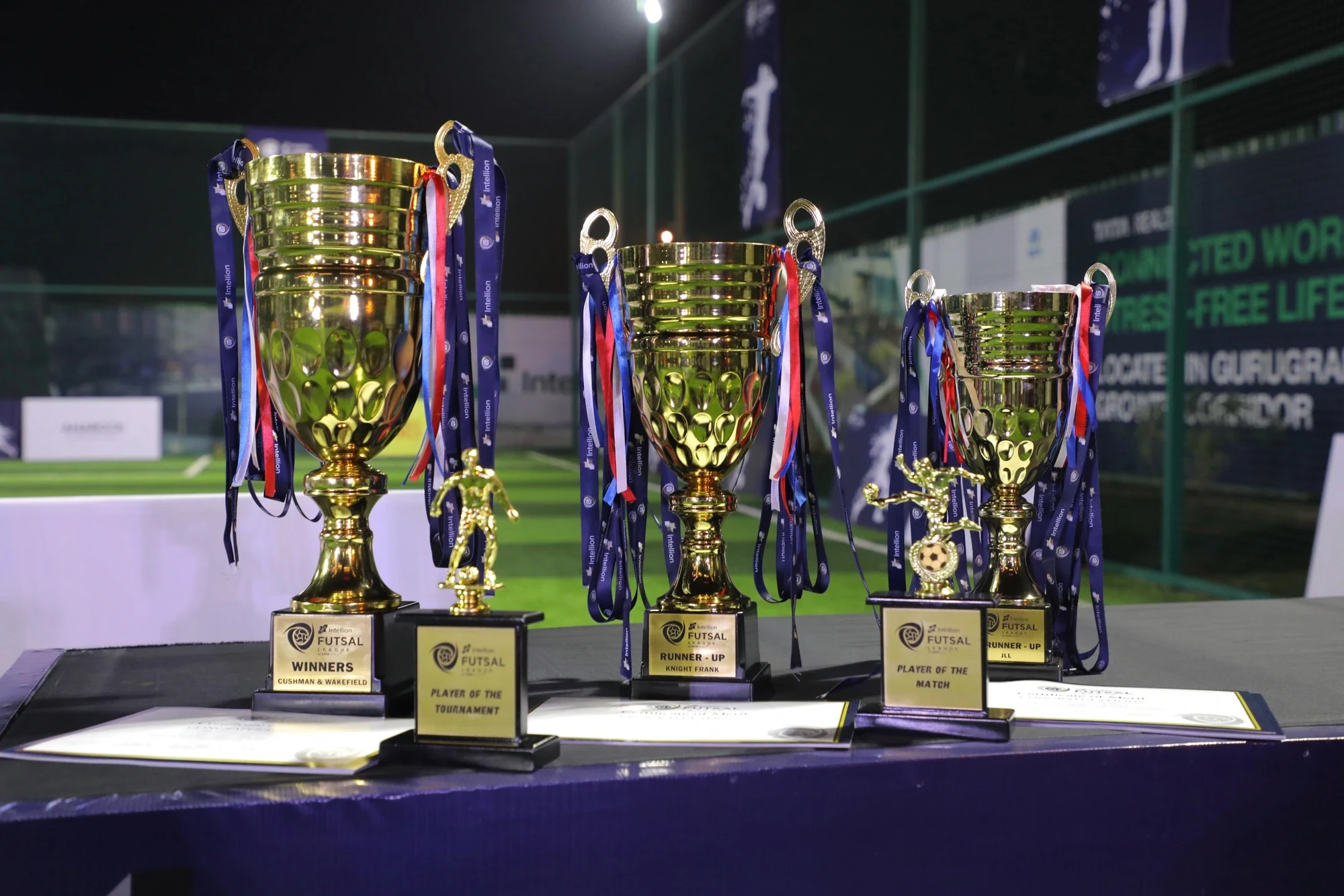 Intellion Futsal League trophies — Winners, Runner-Up and Player of the Tournament