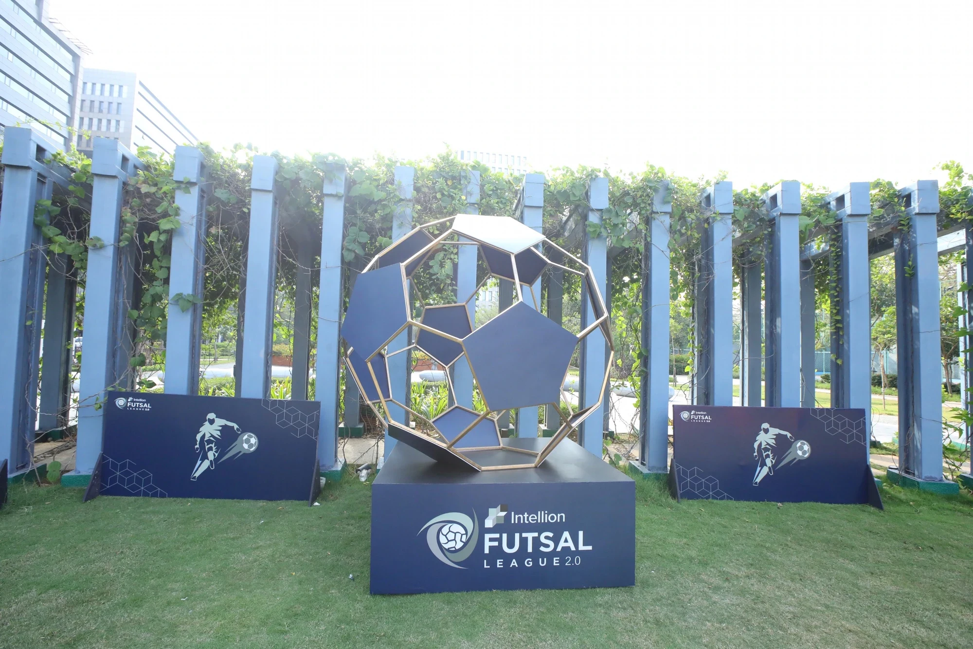 Intellion Futsal League 2.0 football sculpture installation with branded plinth and banners