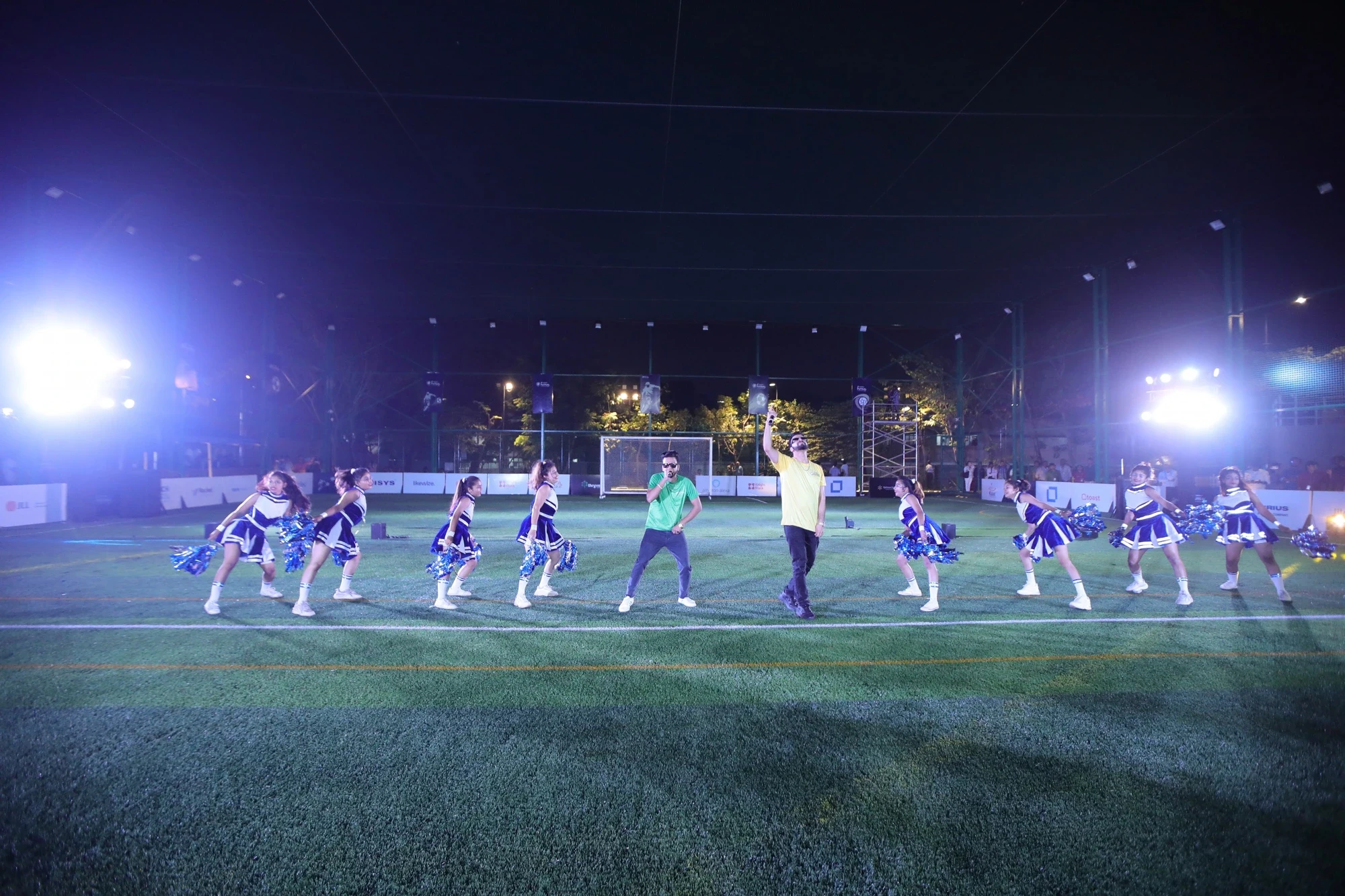 Choreographed opening performance with cheerleaders and live rap at the Season 2 opener