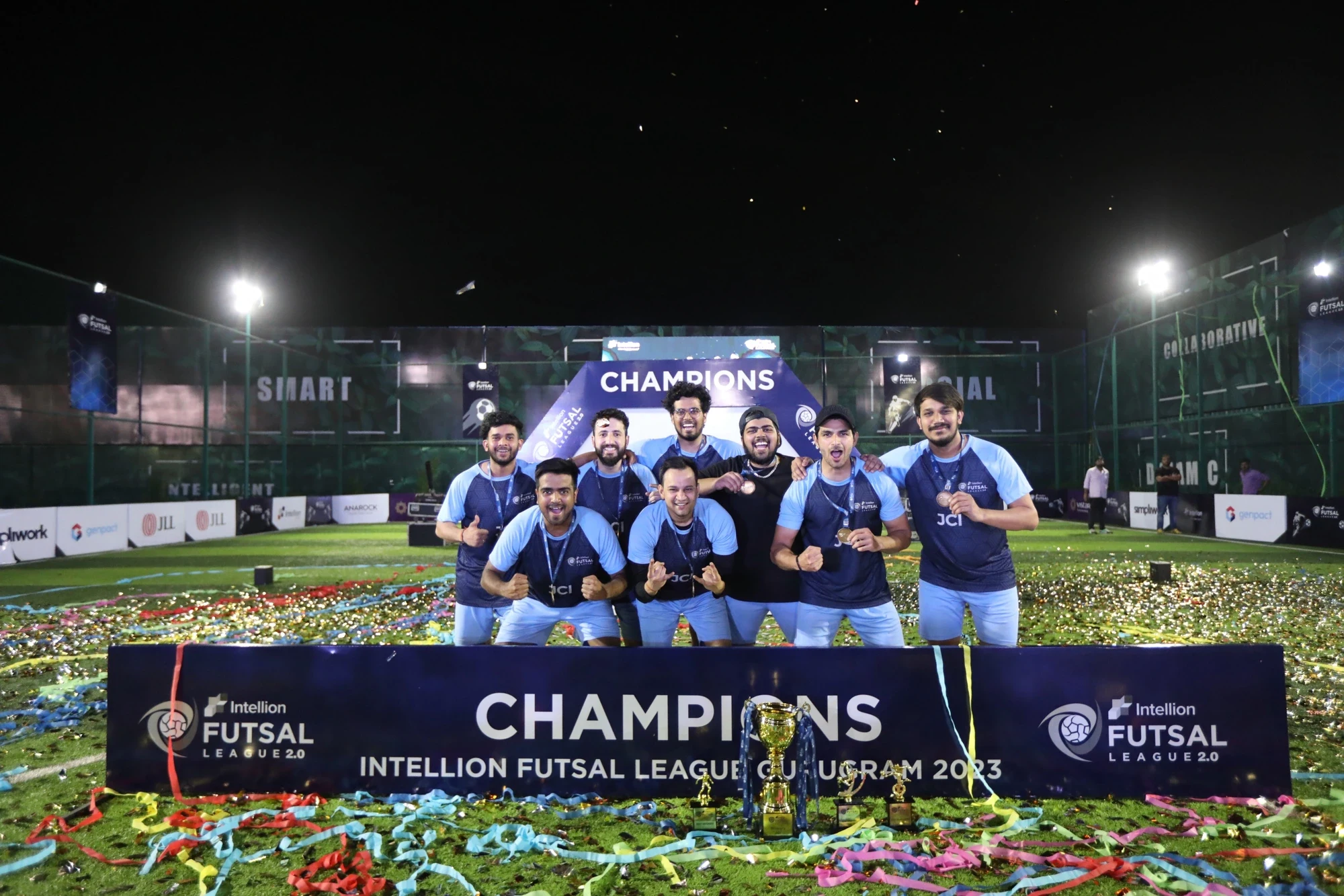 Intellion Futsal League 2.0 Gurugram 2023 champions celebrating with medals and confetti