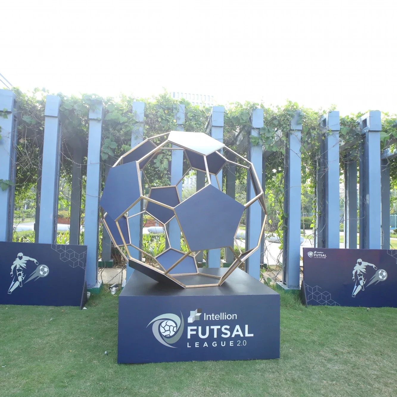 Intellion Futsal League 2.0 football sculpture installation with branded plinth and banners