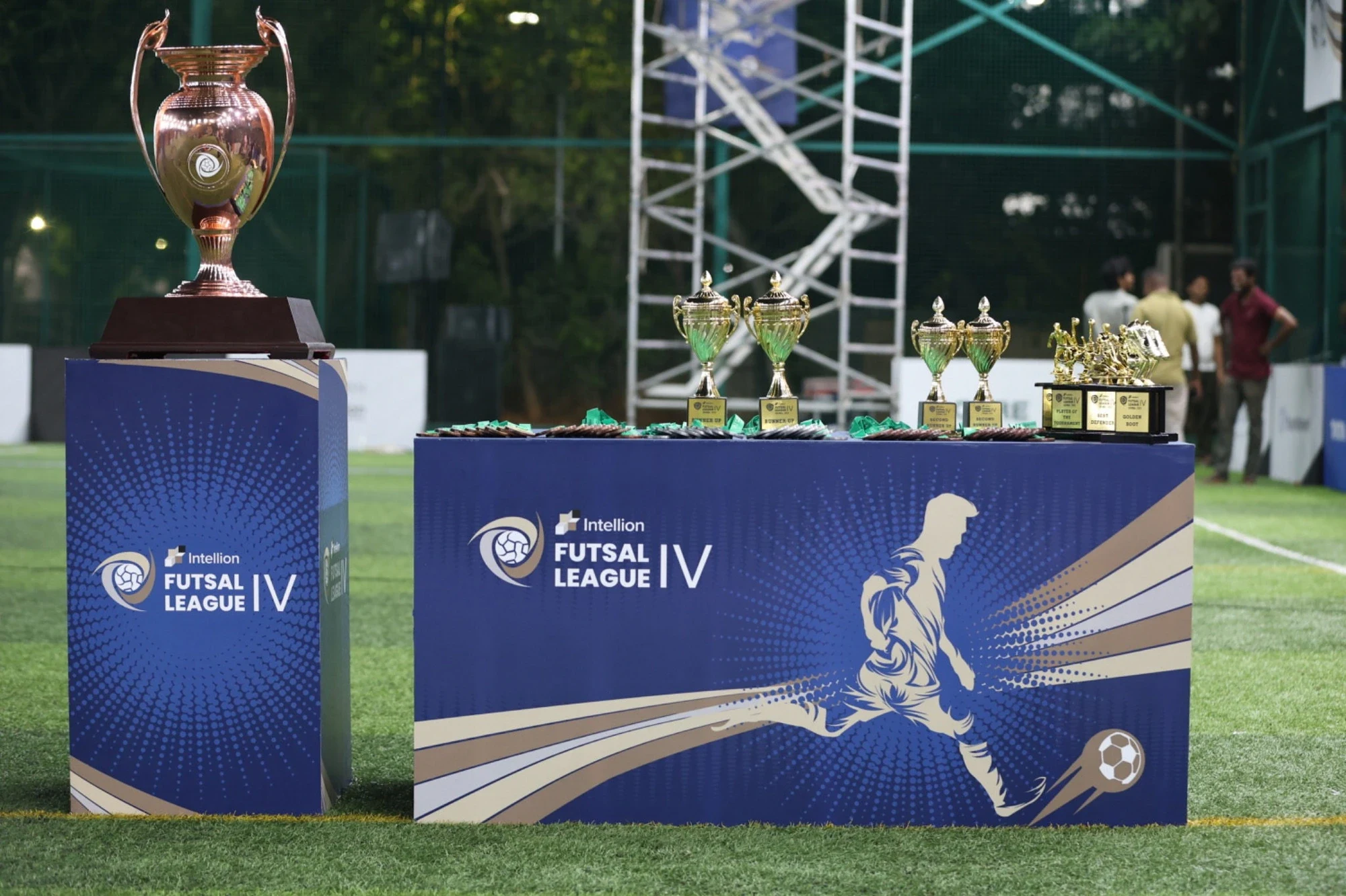 Intellion Futsal League IV trophy display with championship and individual awards