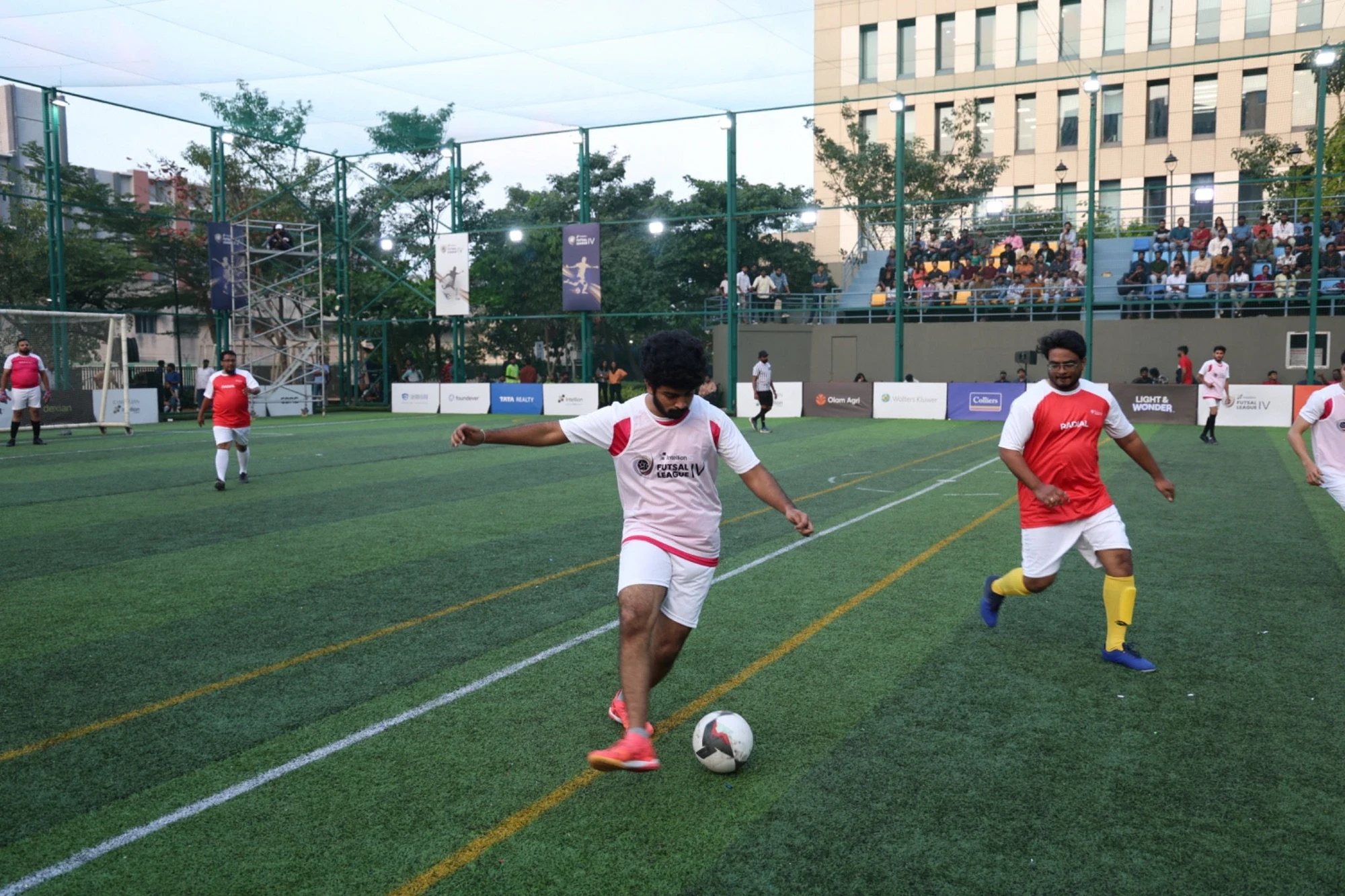 Season 4 league match in progress — player striking the ball at the Intellion arena