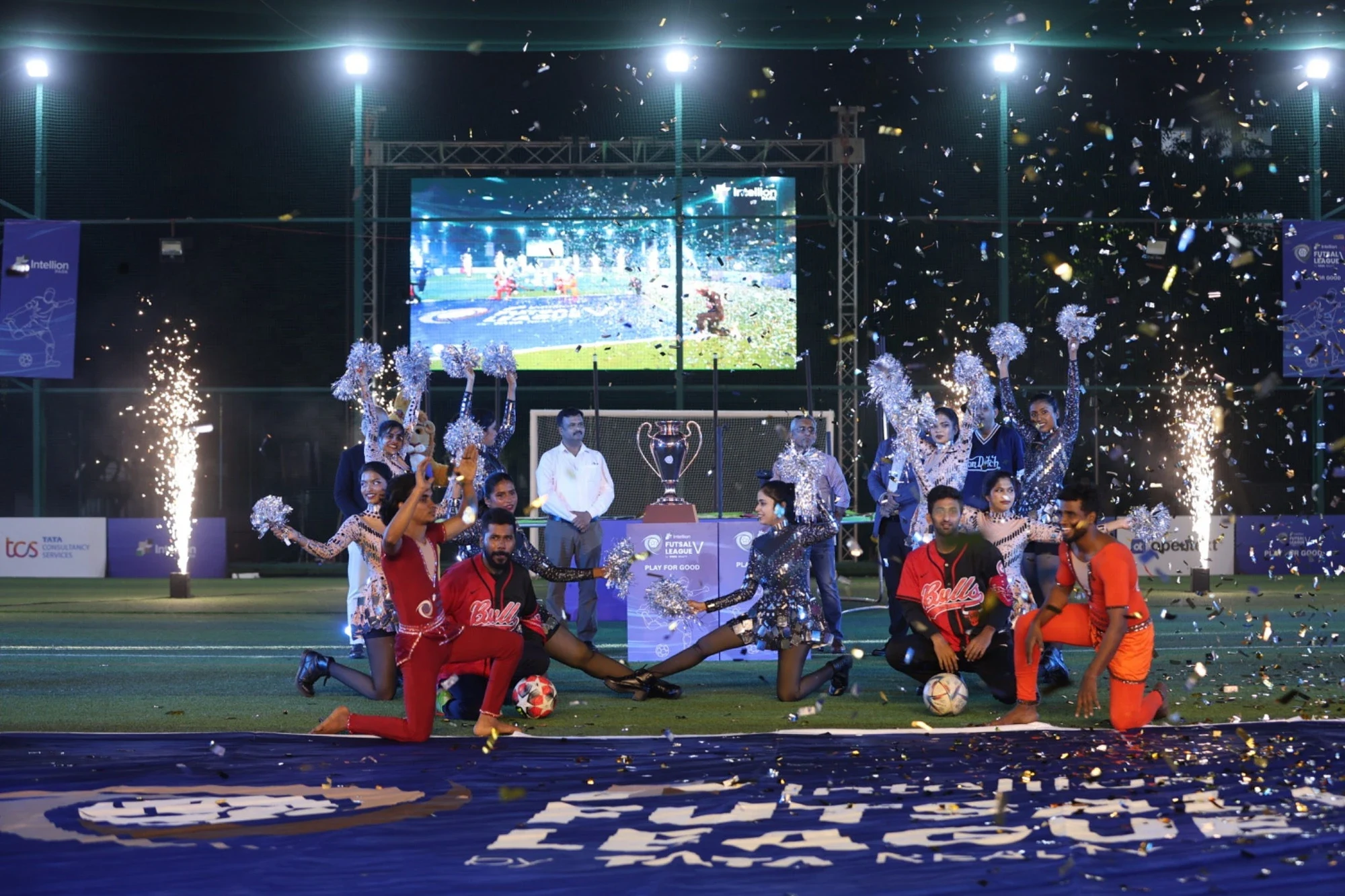 Season 5 finale celebration — performers, cheerleaders and the unveiled trophy amid confetti and pyros