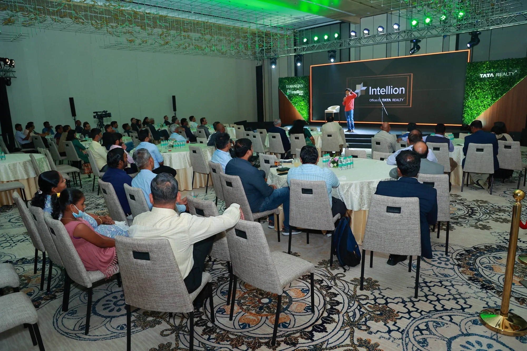 Guests at round tables enjoying the stand-up act at the IPC Networking Evening ballroom
