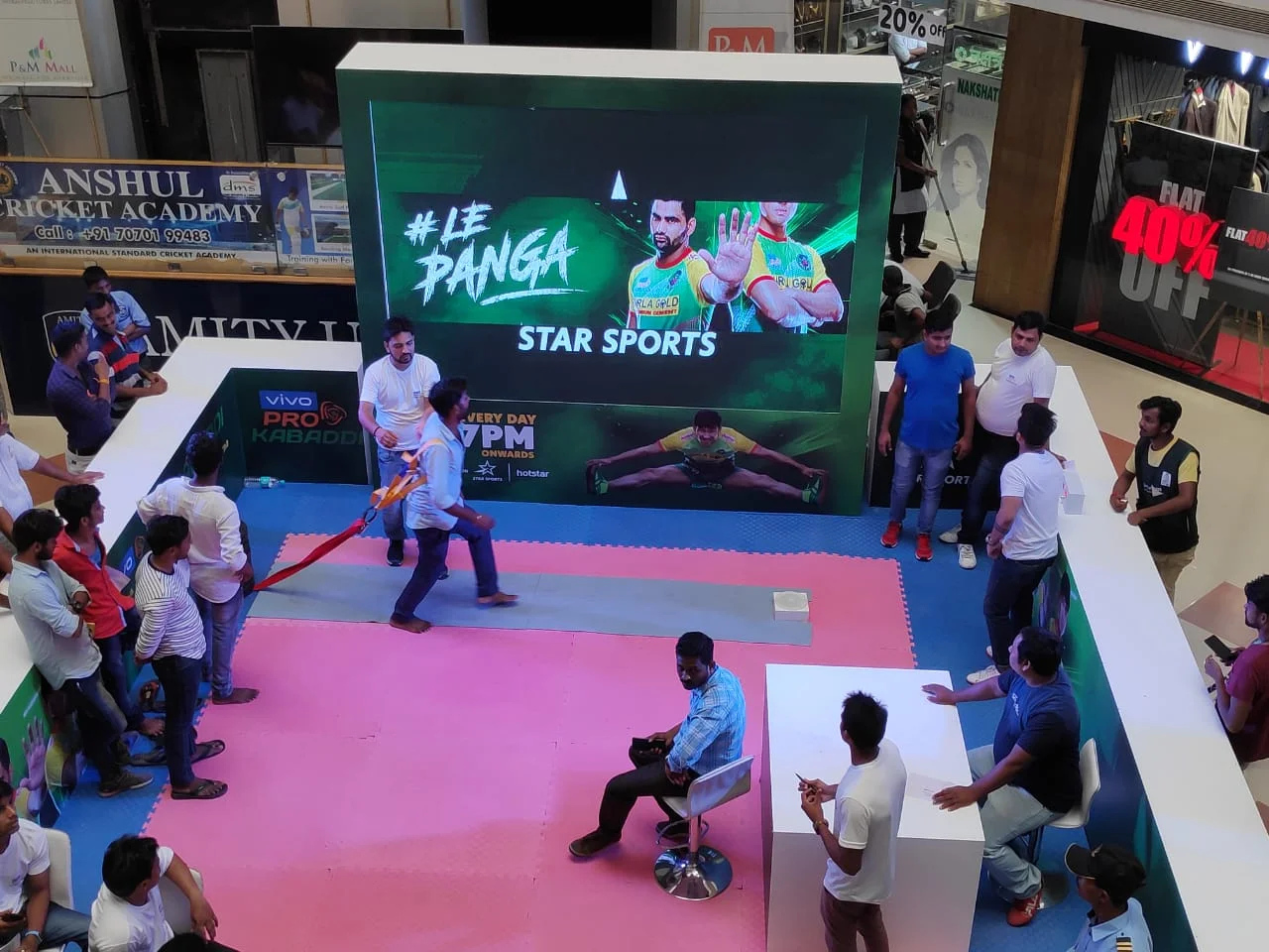 Tug-of-war game in front of the #LePanga Star Sports LED wall at the activation