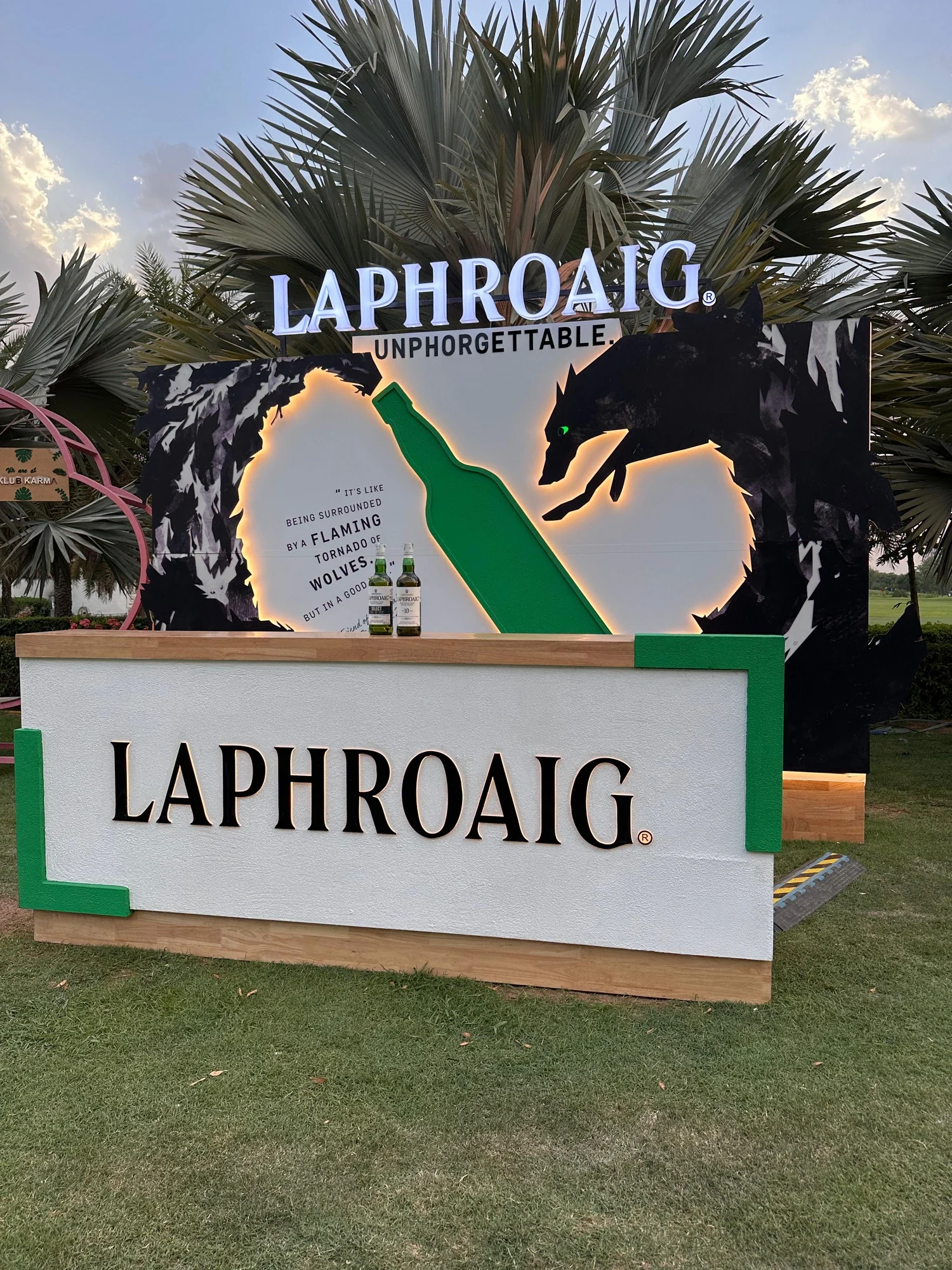 Unphorgettable bar counter with glowing wolf artwork and Laphroaig bottles