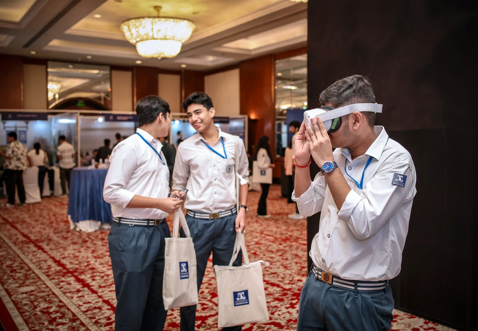 Students trying the VR campus tour at the University of Melbourne roadshow