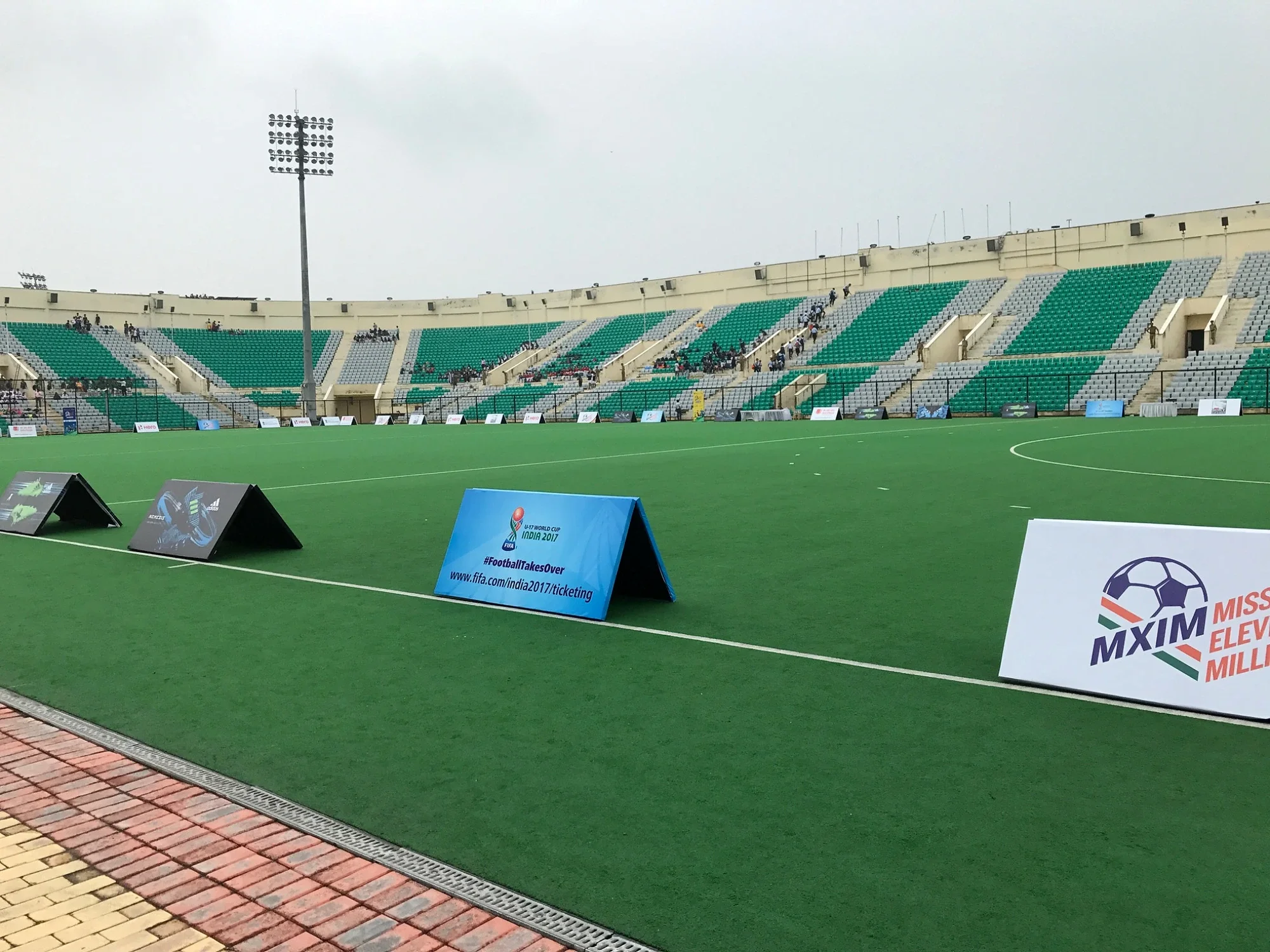 Stadium pitch dressed with FIFA U-17 World Cup India 2017 and MXIM A-frame boards