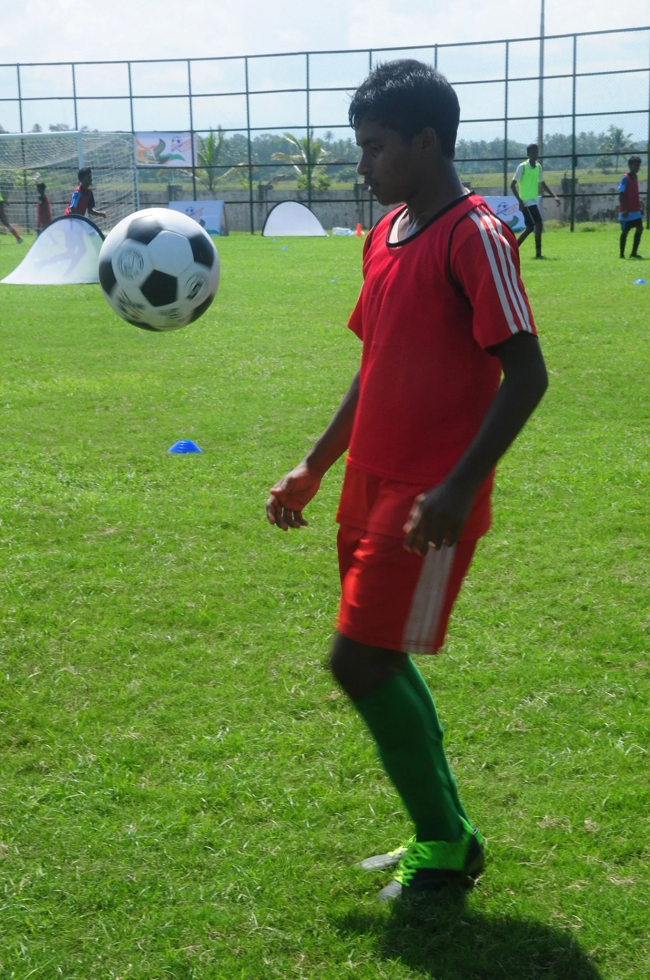 Young trainee practising ball control at a Mission Eleven Million coaching session