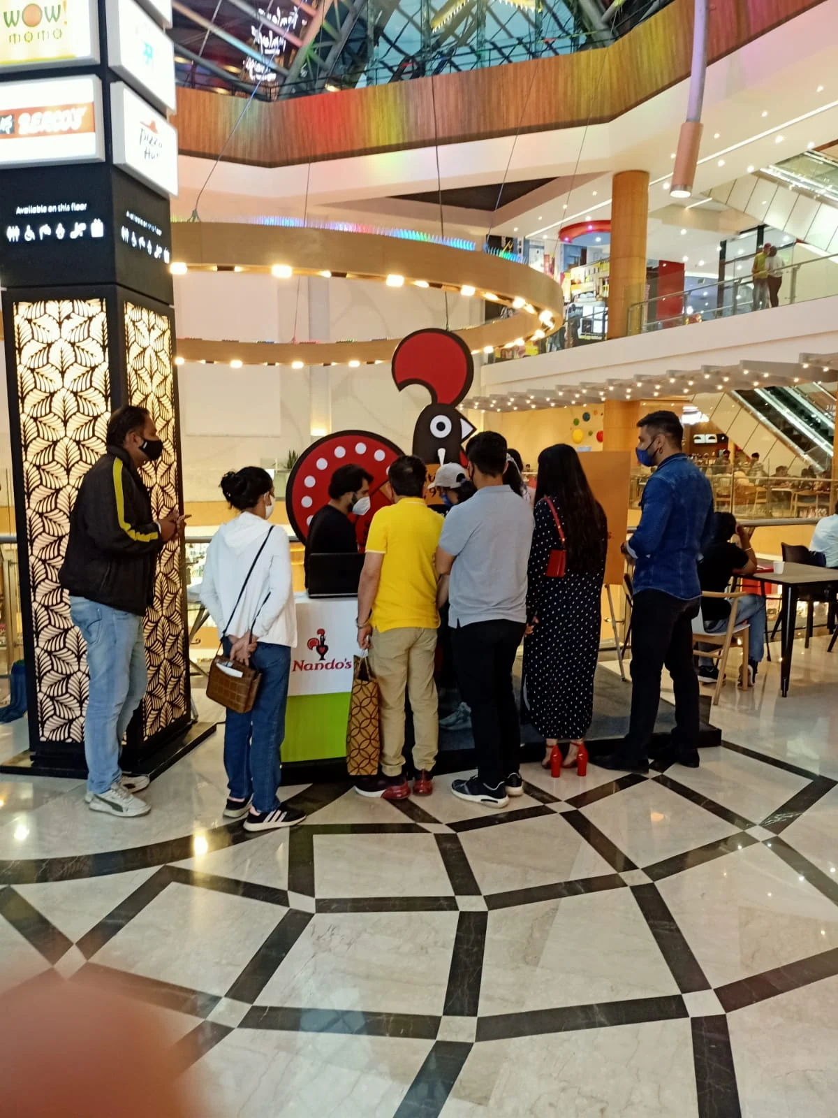 Queue of shoppers waiting for their spin at the Nando's mall activation