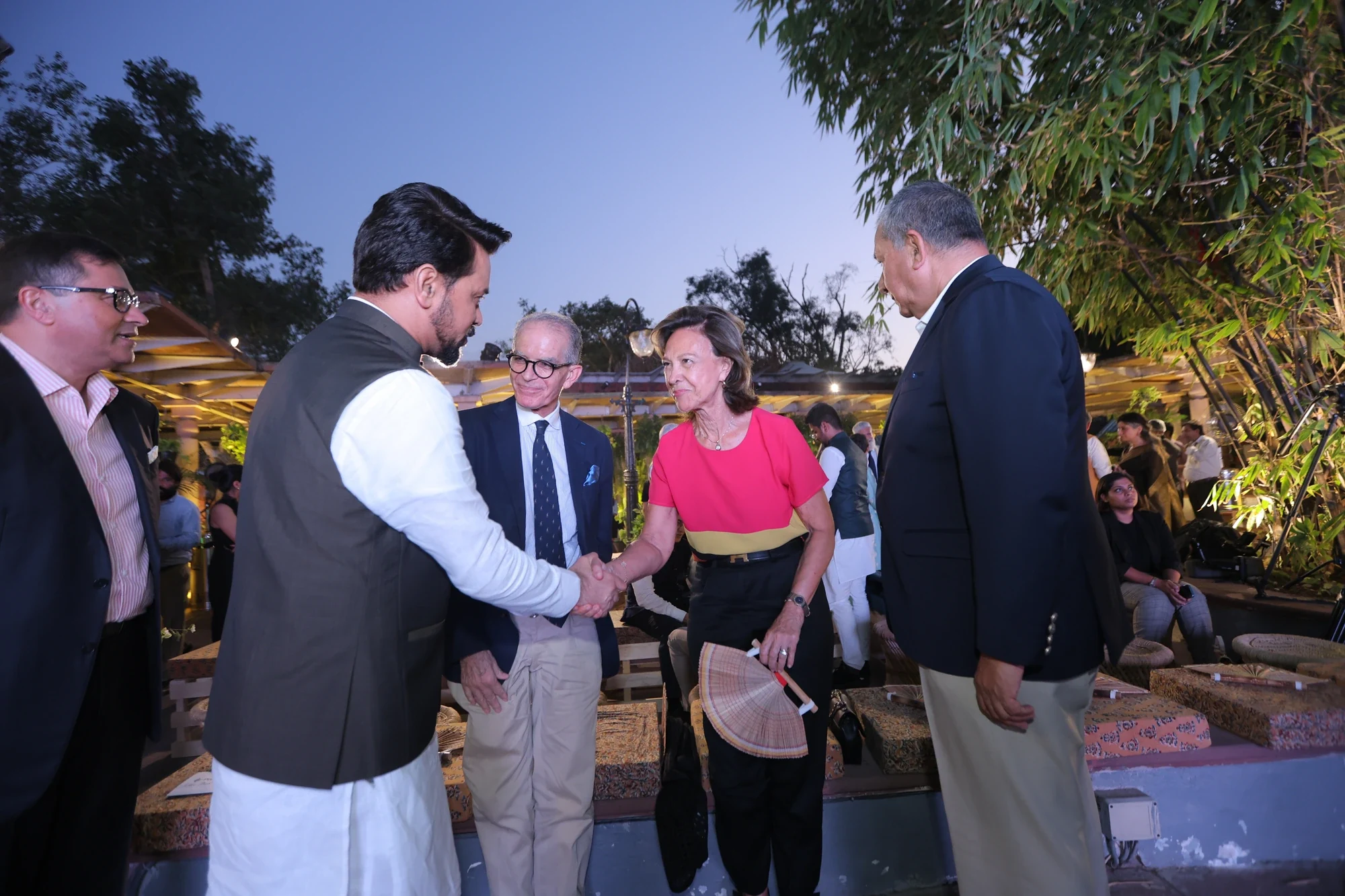 Hosts welcoming global delegates at dusk during the G20 Cultural Evening