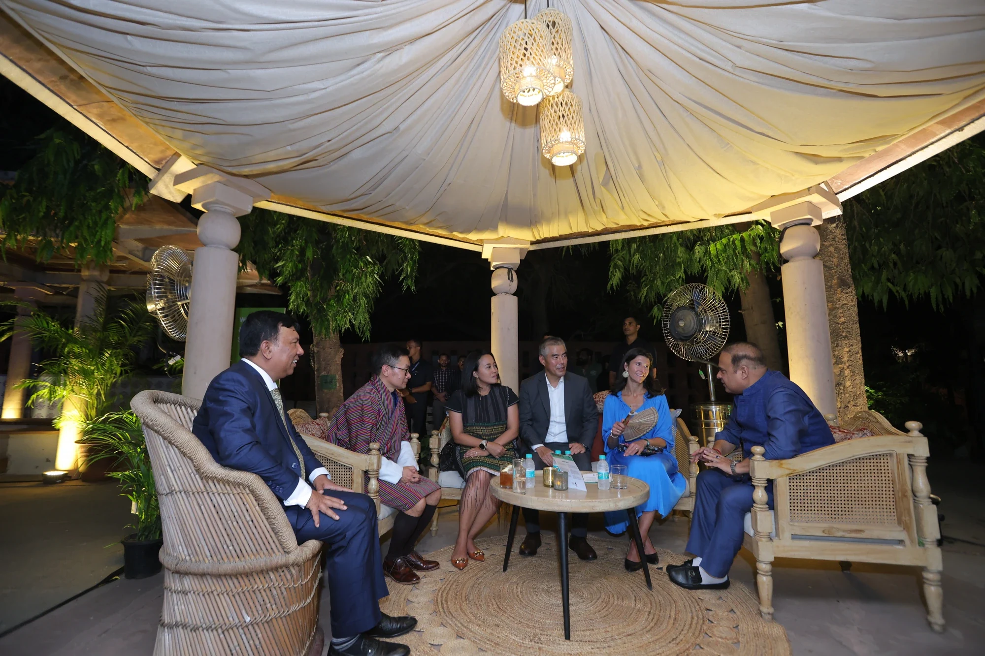 Evening networking in the lantern-lit canopy lounge