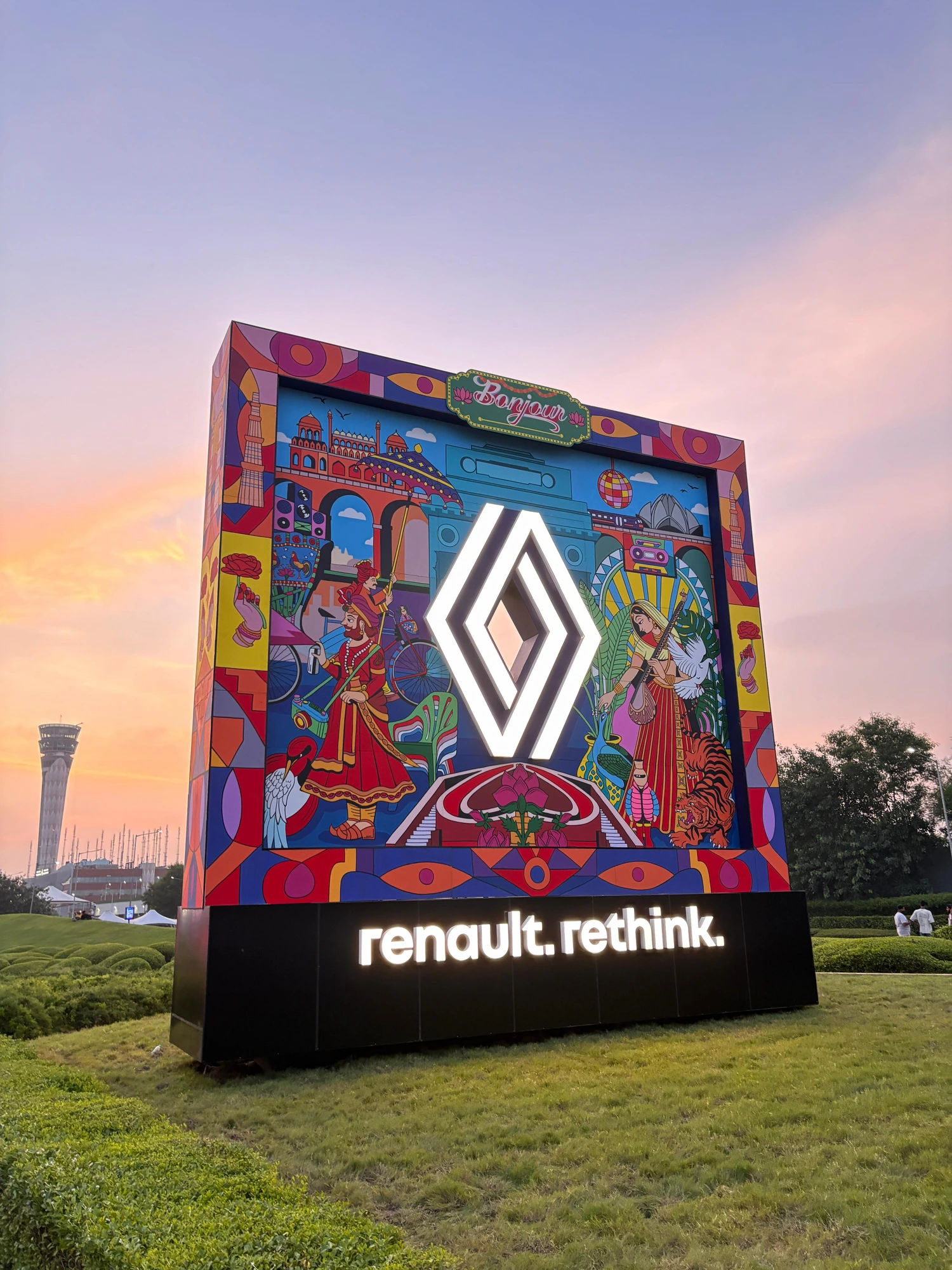 Renault rethink installation glowing against a dusk sky at IGI Airport