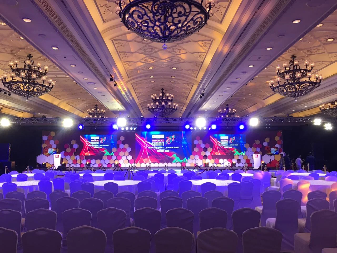 The Republic Summit ballroom set with chandelier ceiling and full stage production