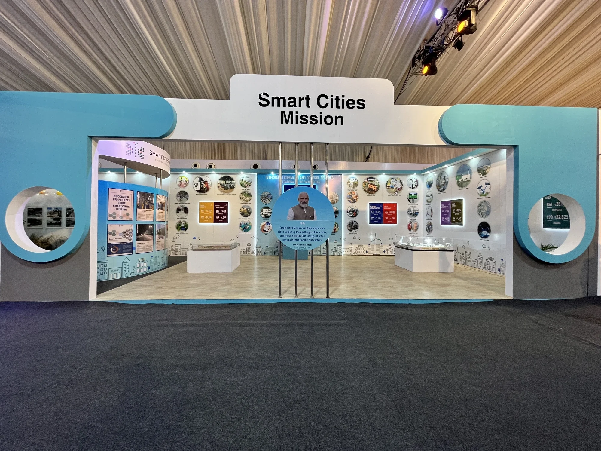 Smart Cities Mission pavilion exterior with circular windows and the PM's quote centerpiece