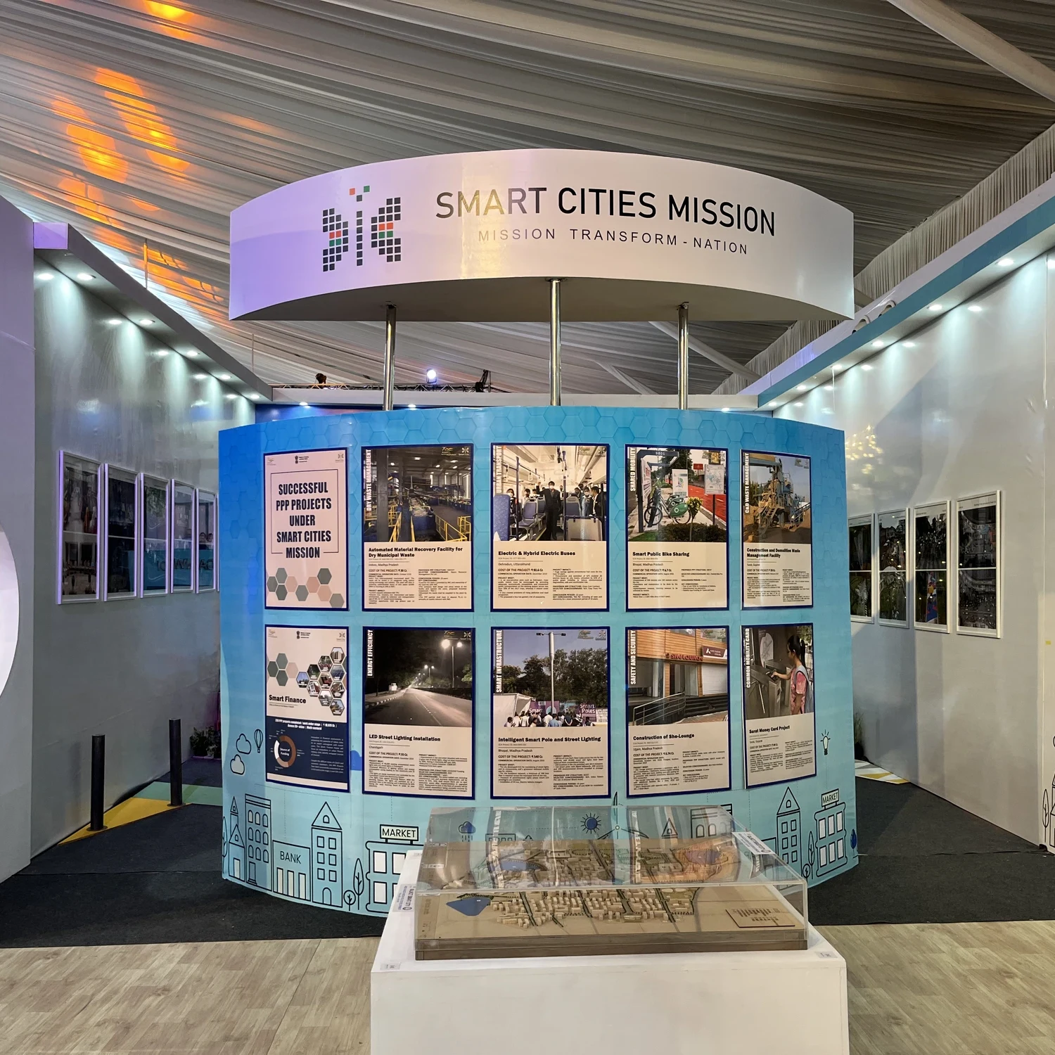 Smart Cities Mission pavilion with circular header and Successful PPP Projects showcase wall