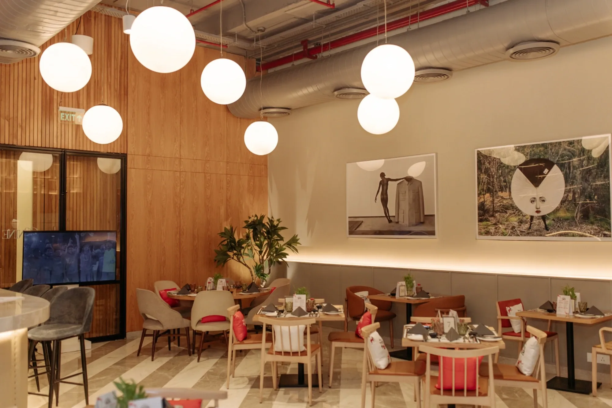 The Third Hour venue styled with globe pendant lights and curated artwork before guests arrive