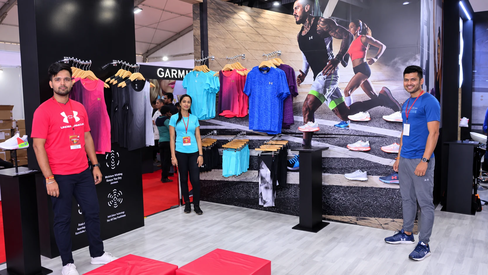 Team members at the Under Armour apparel and footwear display