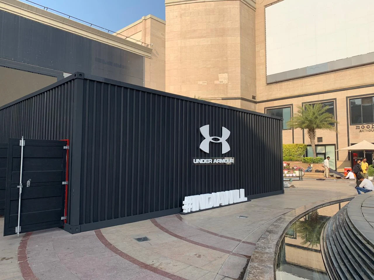 The customized Under Armour container setup with #INDIAWILL letters at the India launch