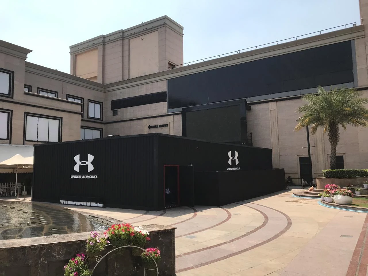 Wide view of the Under Armour container installation at the mall courtyard