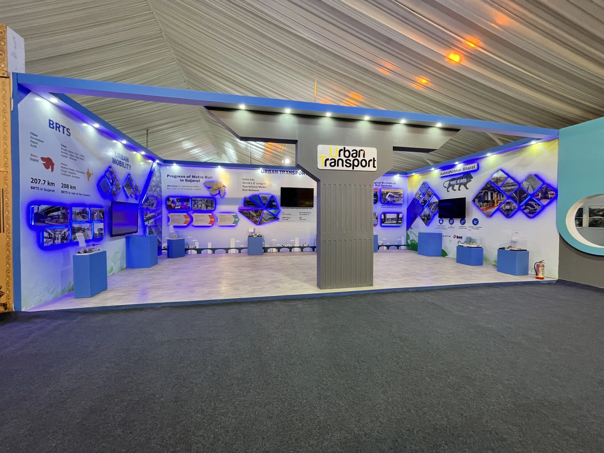 Urban Mobility Pavilion exterior with the Urban Transport pillar and blue accent lighting
