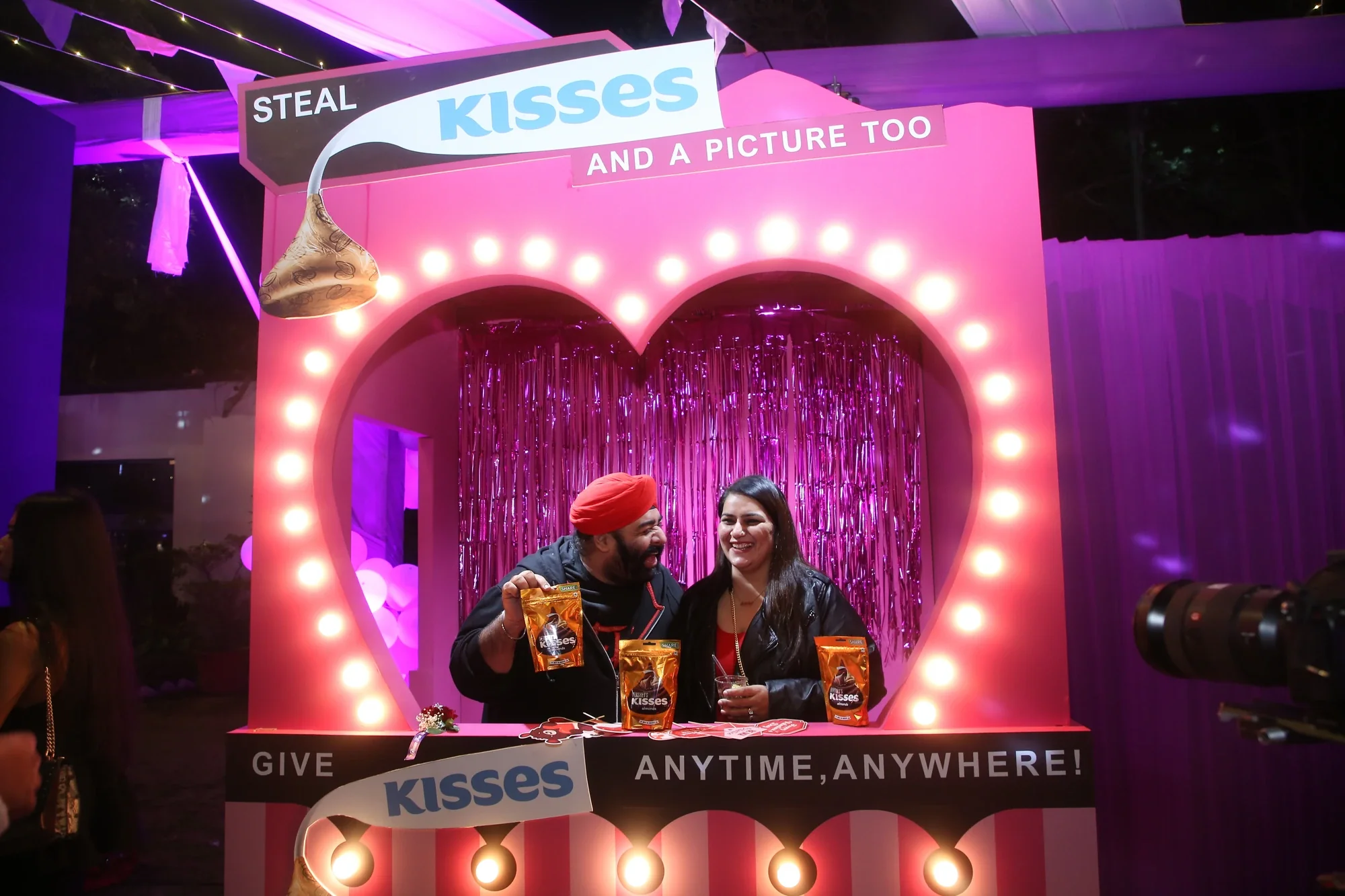 Hershey's Kisses photo booth — Steal Kisses and a Picture Too marquee with guests