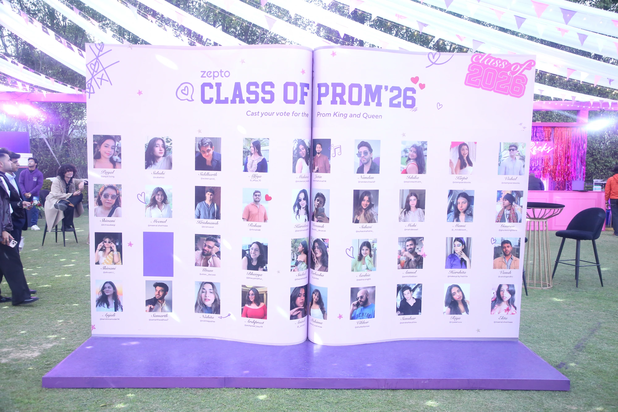 Zepto Class of Prom '26 installation — a giant yearbook of creator portraits